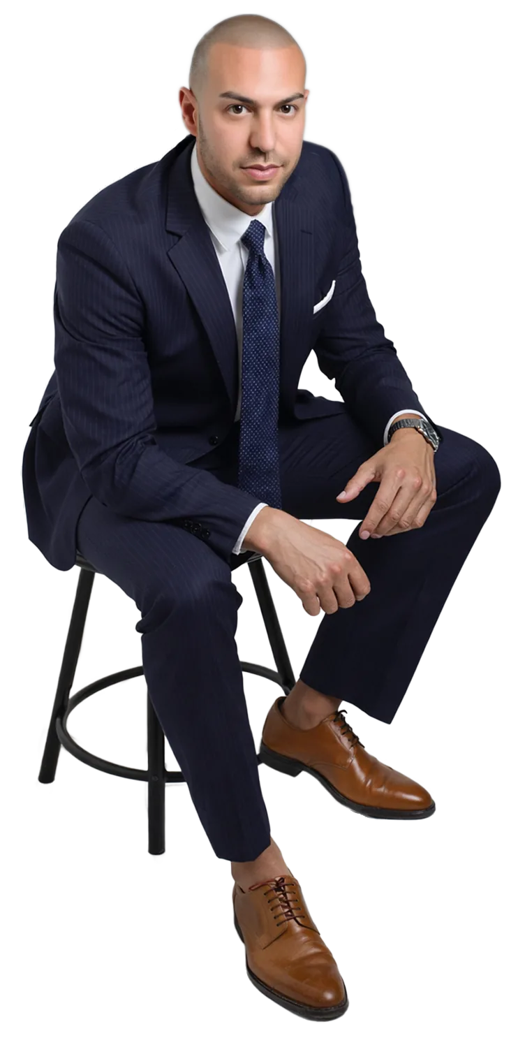 Portrait of Oliver Martin seated on a stool